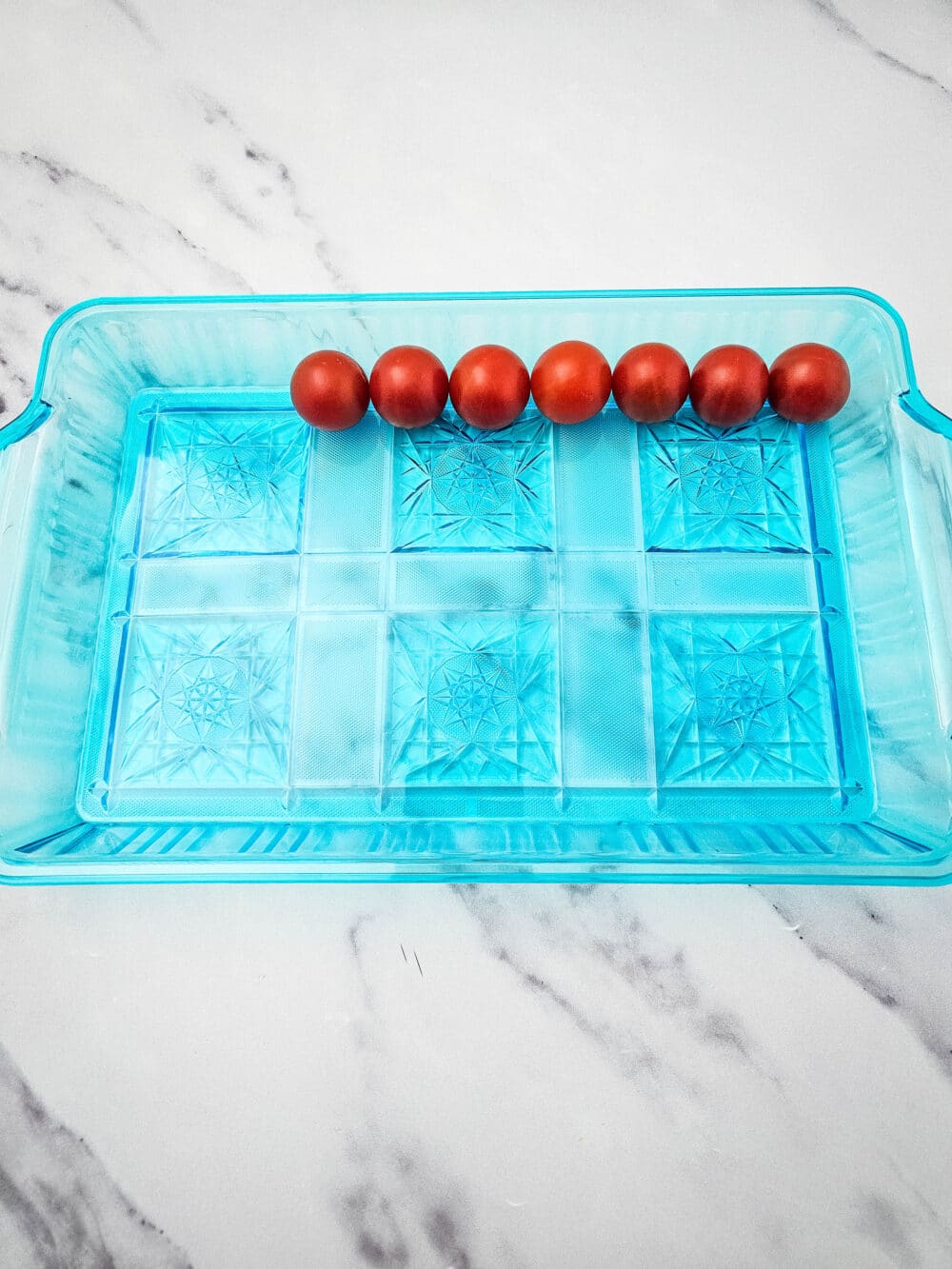 lining tray with cherry tomatoes