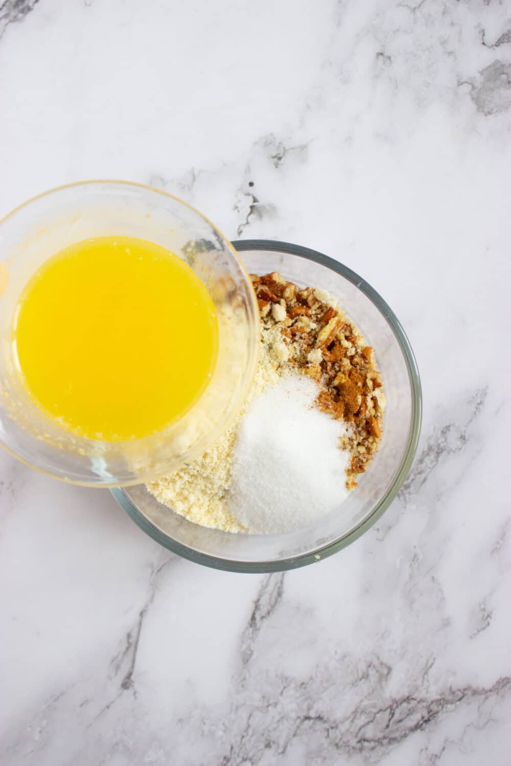 adding melted butter to crust mixture