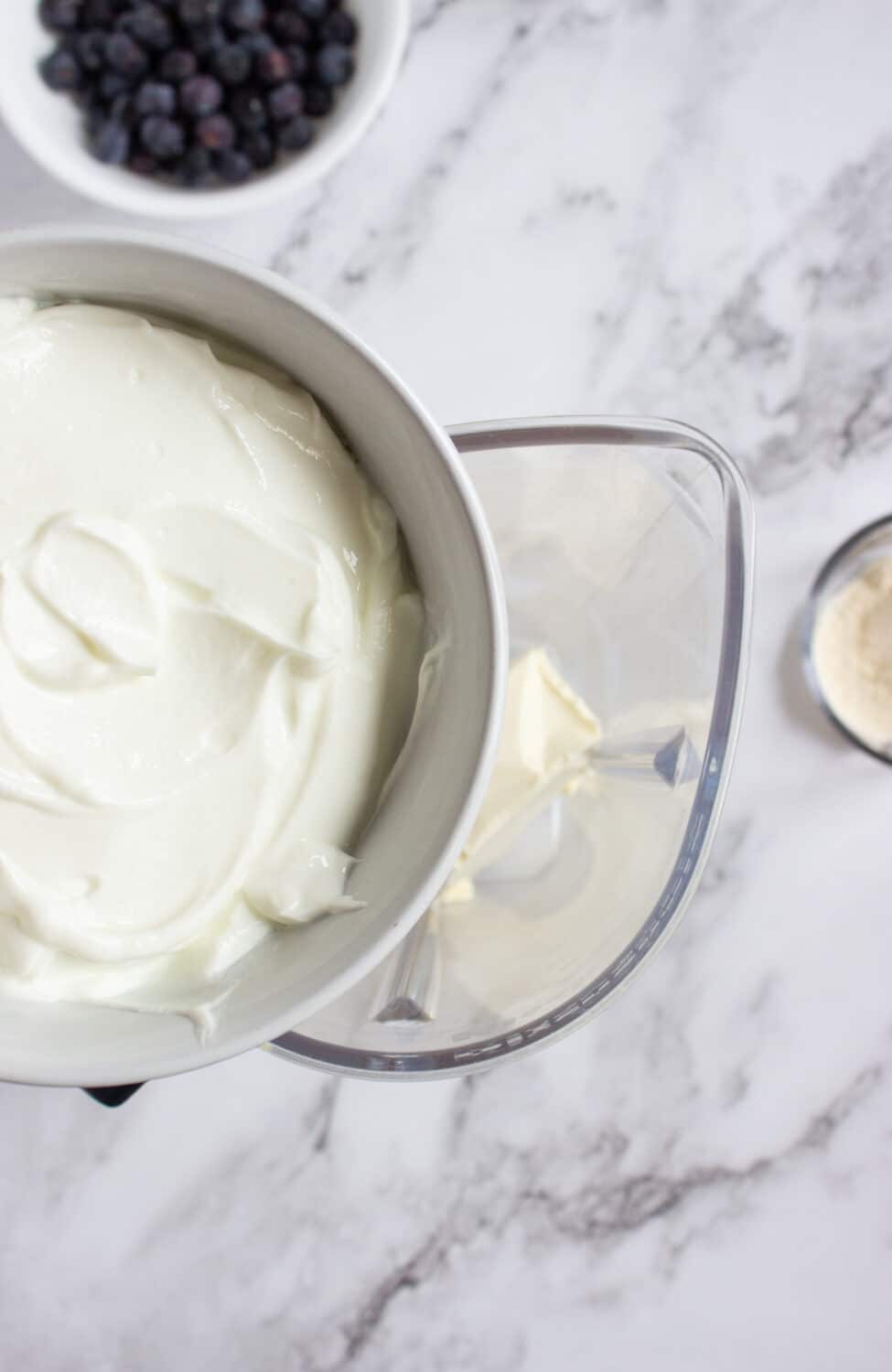 adding greek yogurt to a blender