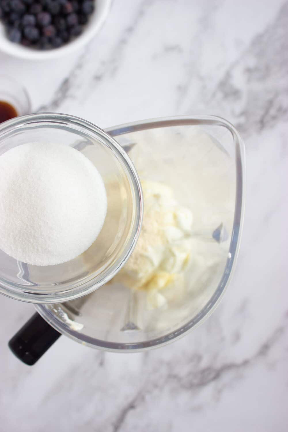 adding sweetener to a blender