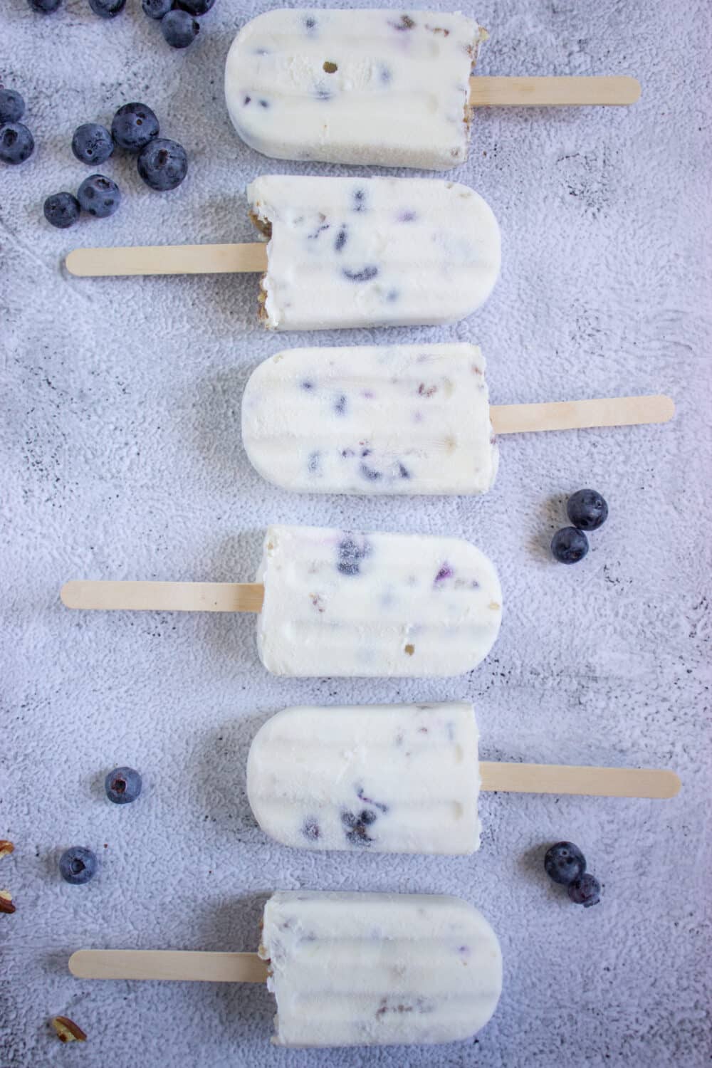 Keto Protein Blueberry Cheesecake Popsicles side by side