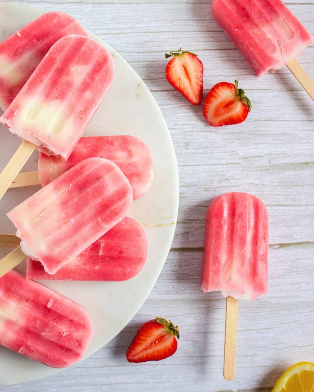 Strawberry Lemonade Greek Yogurt Popsicles on a platter