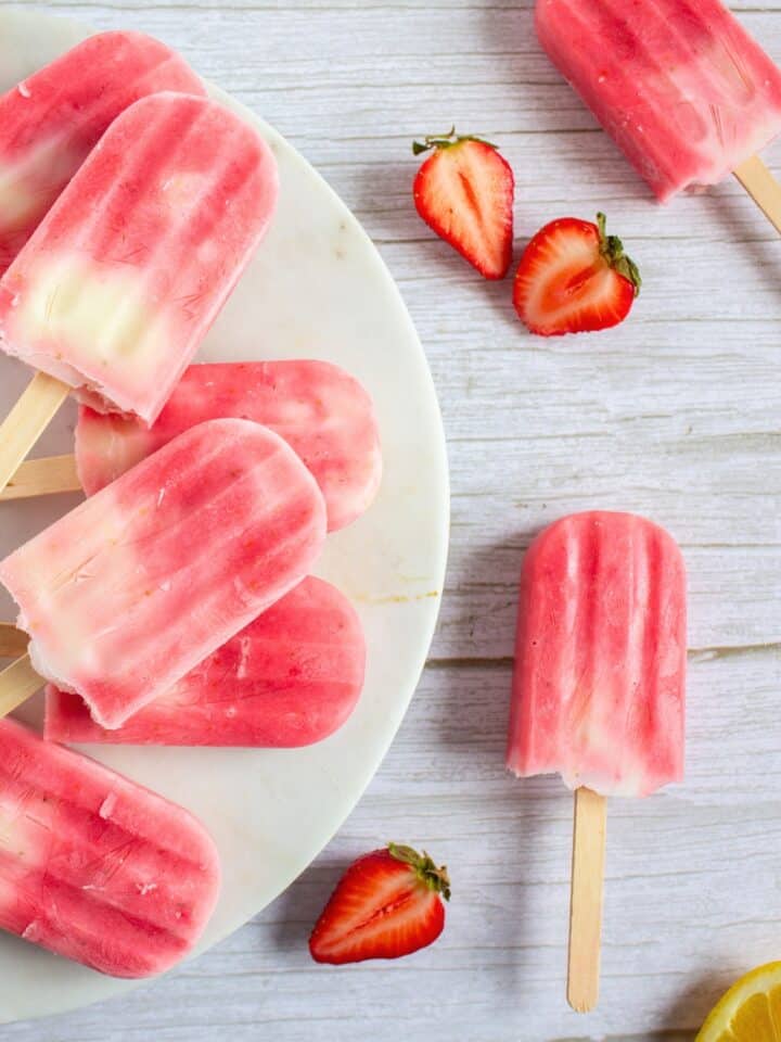 Strawberry Lemonade Greek Yogurt Popsicles on a platter