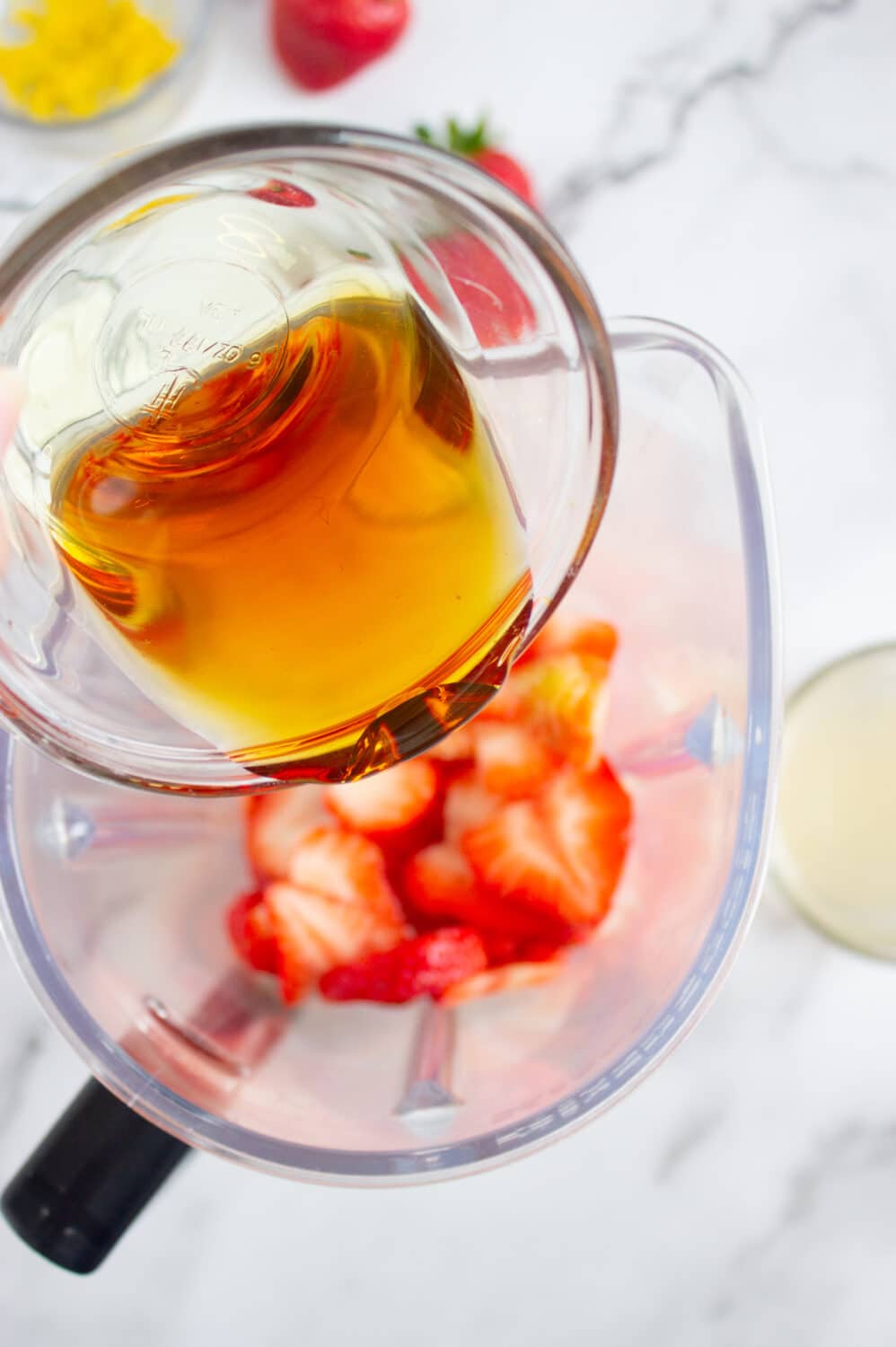 pouring honey into blender