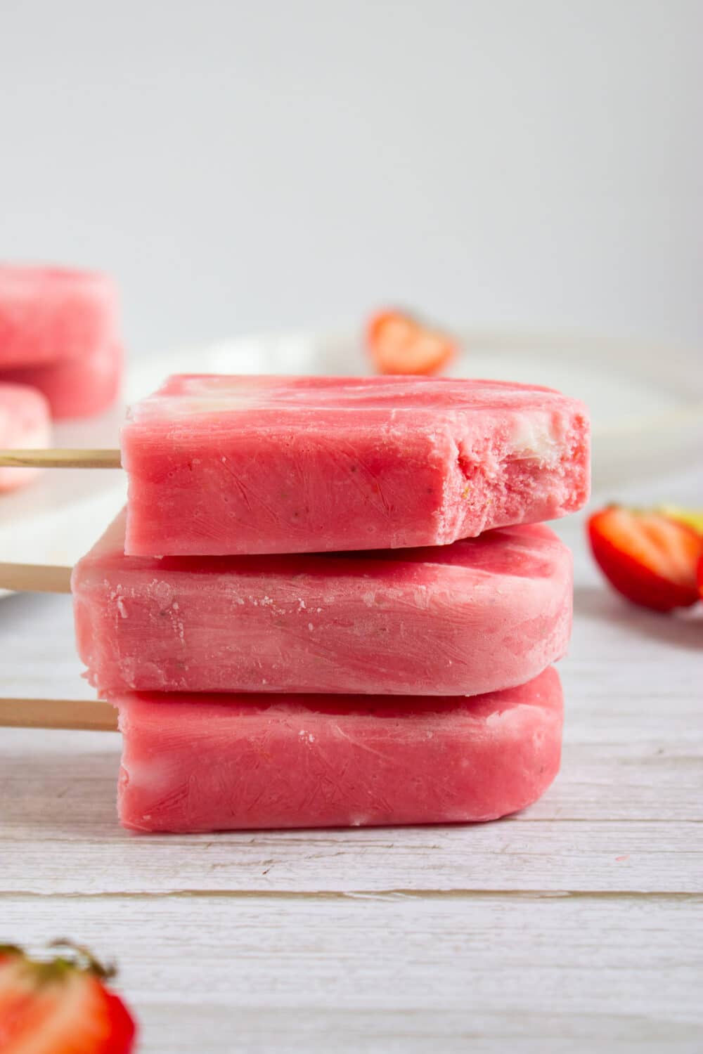 side view of Strawberry Lemonade Greek Yogurt Popsicles