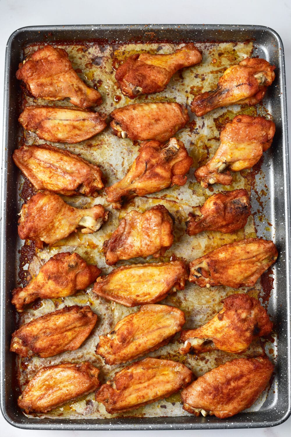 baking chicken wings fresh from the oven ready for sauce