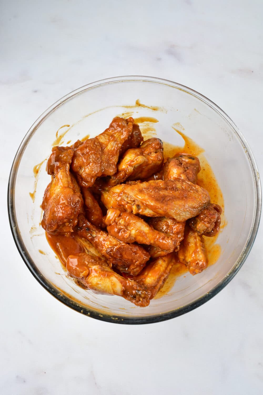 baked buffalo wings tossed in homemade buffalo sauce