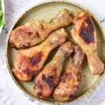 Baked Honey Mustard Chicken Drumsticks overhead view with ketchup and garnish