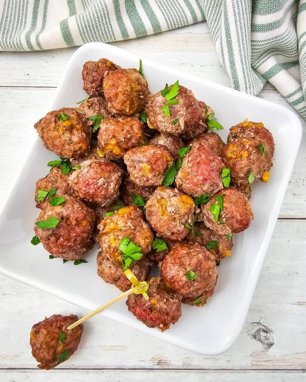 overhead view of Carnivore Meatballs with one bite shown on a toothpick