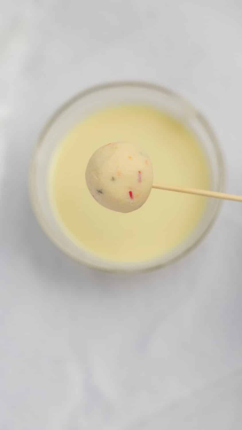 ready to dip one cake pop in coating