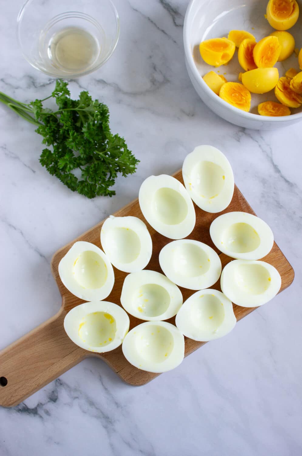 halves of boiled eggs ready to be filled