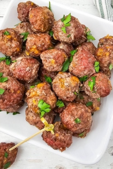 overhead view of Carnivore Meatballs with one bite shown on a toothpick