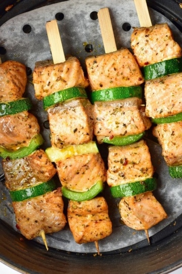 overhead view of Air Fryer Salmon Skewers in an air fryer basket