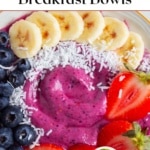 Berry smoothie bowl with bananas and coconut on white plate