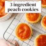 Baked peach cookies topped with glossy peach butter, cooling on a wire rack.